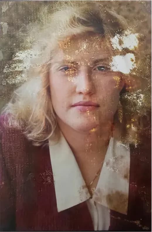 A treasured discoloured photograph, worn with time, before being restored