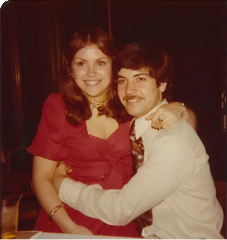 A treasured discoloured photograph, worn with time, before being restored