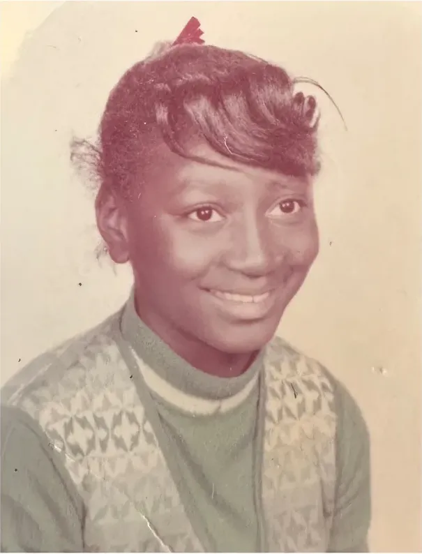A treasured discoloured photograph, worn with time, before being restored