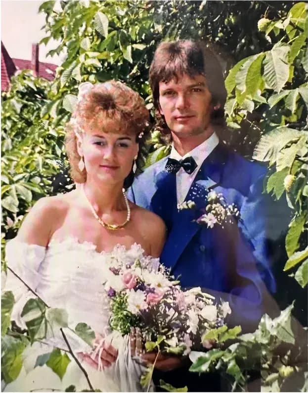 A treasured faded photograph, worn with time, before being restored